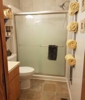 Shower, hair dryer, towels, soap