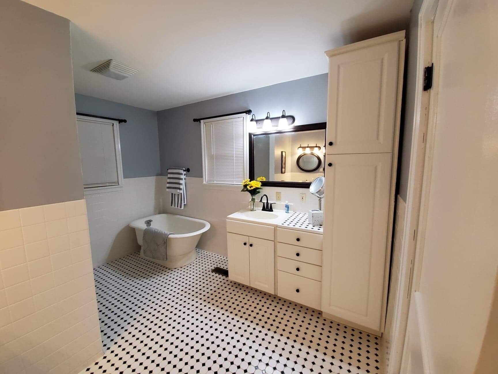 Bathtub, hair dryer, towels, soap