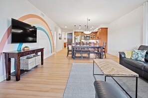Enjoy a comfortable stay in this apartment with a spacious living area, flat-screen TV, and dining table for four.