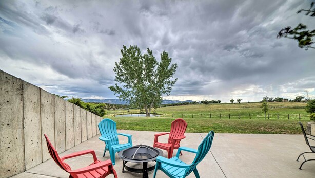 An outdoor patio with four Adirondack chairs and a fire pit. - Walkout Apartment w/ Mtn View on Cortez Ranch (Cortez)