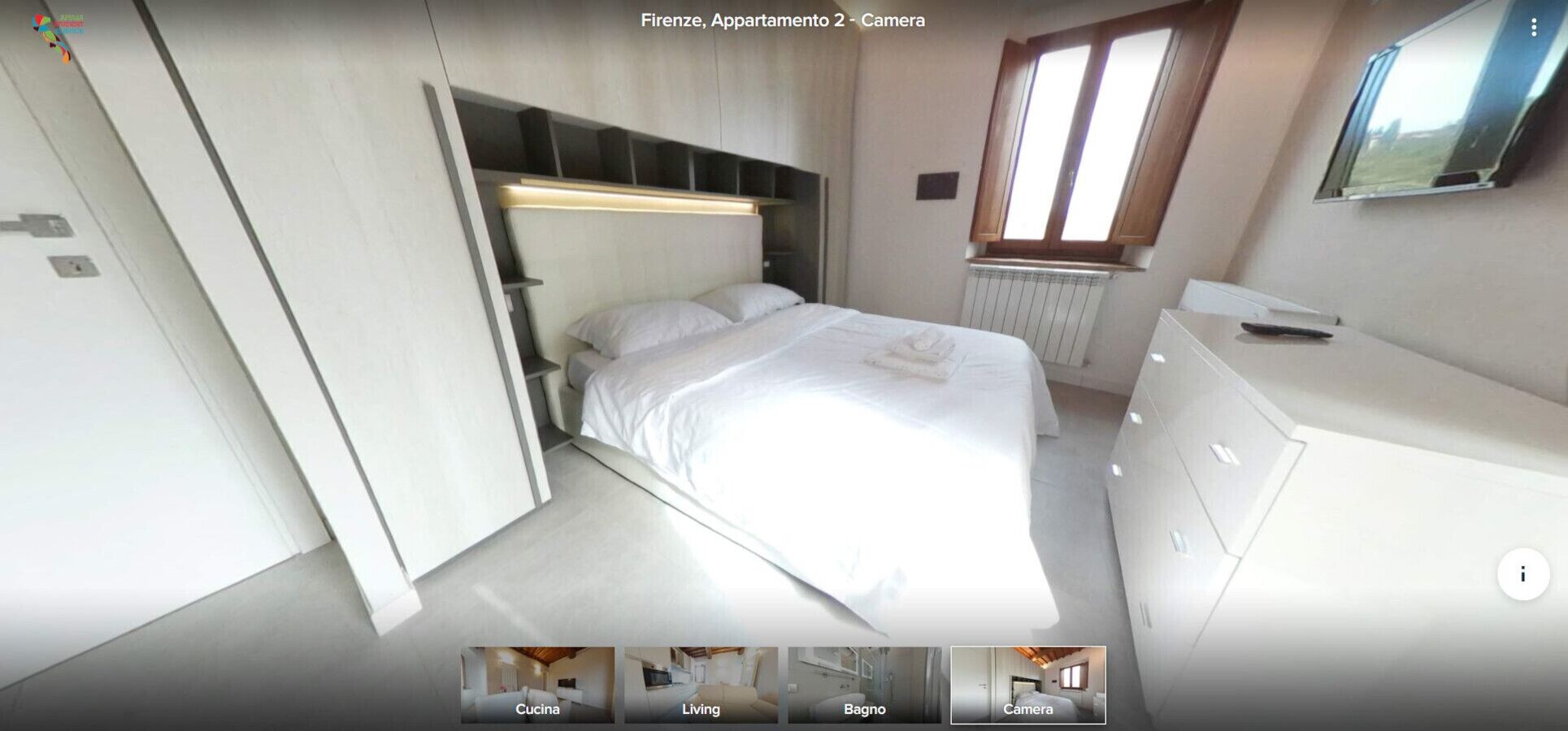 Una camera da letto moderna con un letto, comodini, un armadio e una finestra.
