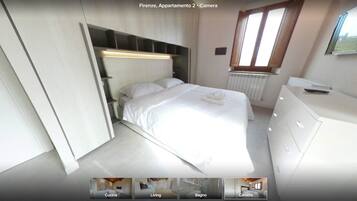 Una camera da letto moderna con un letto, comodini, un armadio e una finestra.
