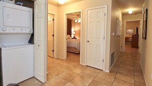 A hotel room with a bed, a bathroom, and a kitchenette. - Good Night Sleep Tight | Guadalupe Riverfront | WiFi | Pools (New Braunfels)
