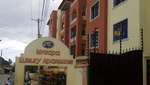 A building with a sign reading "MHWopa Luxury Apartments". - Mtwapa Luxury Apartment by Blodriff Hospitality (Mtwapa)
