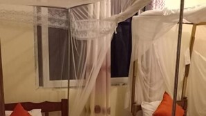 A room with two beds, each with a canopy. There is a window with curtains, and the beds have pillows. - Mtwapa Luxury Apartment by Blodriff Hospitality (Mtwapa)