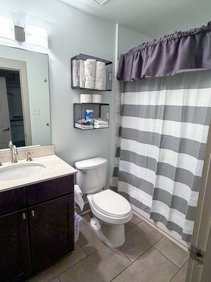 Combined shower/bathtub, hair dryer, towels, soap