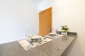 Exclusive Studio Suite, 1 King Bed with Sofa bed | Private kitchen | Full-size fridge, microwave, stovetop, espresso maker