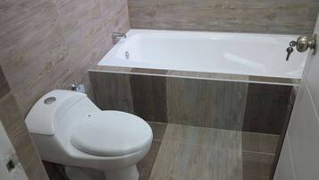 Combined shower/bathtub, hair dryer, towels, soap