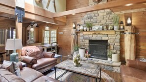 A cozy living room with leather sofas, a fireplace, and wooden beams. - Secluded Cabin, Comfortable Lux, Valley View ~ Canaan Valley & Seneca (Harman)