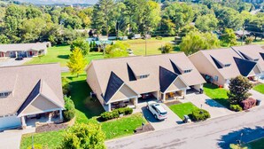 A residential area with multiple houses featuring sloped roofs and attached garages.