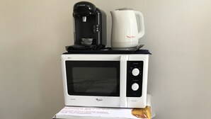 A compact kitchenette with a microwave, coffee maker, and refrigerator. - independent house (Chartres)