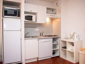 Enjoy cooking in this fully equipped kitchen with a gas stove, microwave, and dishwasher.
