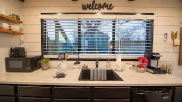 Fridge, coffee/tea maker, cookware/dishes/utensils