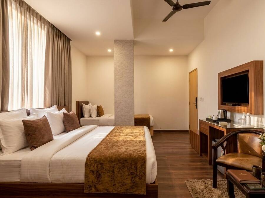 Habitación Deluxe | Ropa de cama de alta calidad y edredones de plumas