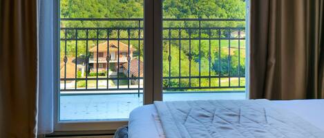 King Room with Balcony | Premium bedding, memory foam beds, in-room safe, desk