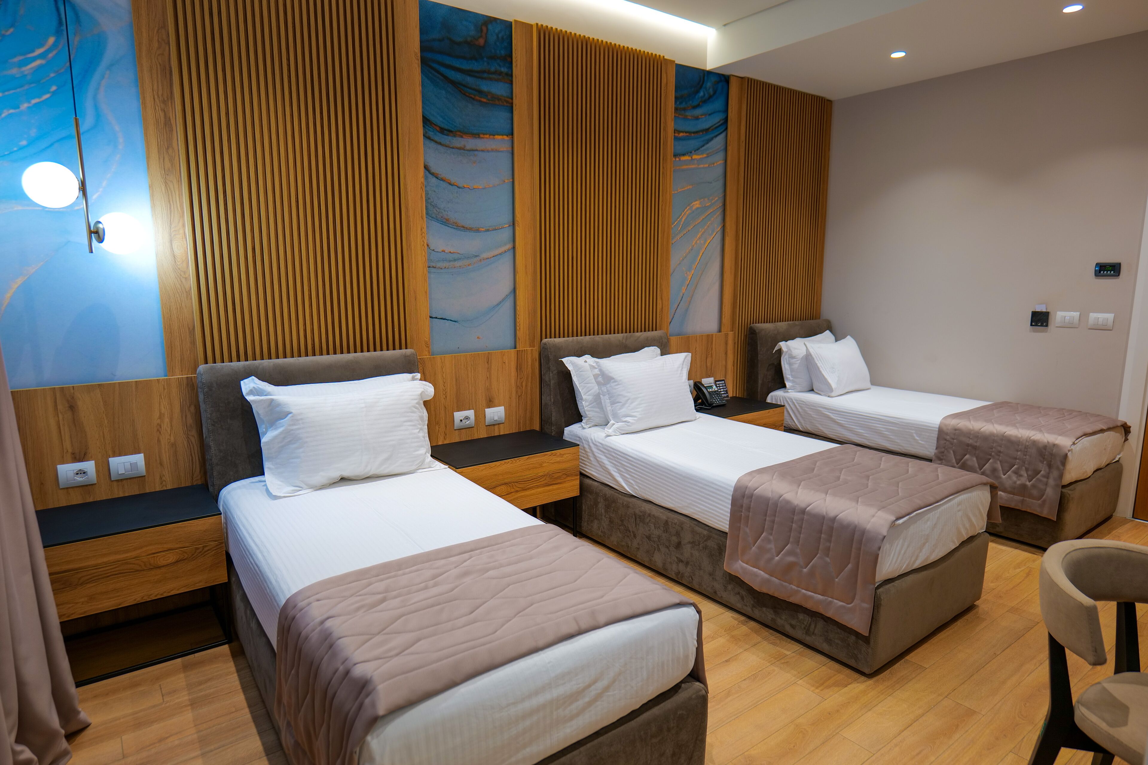 deluxe triple room | premium bedding, memory-foam beds, in-room safe, desk