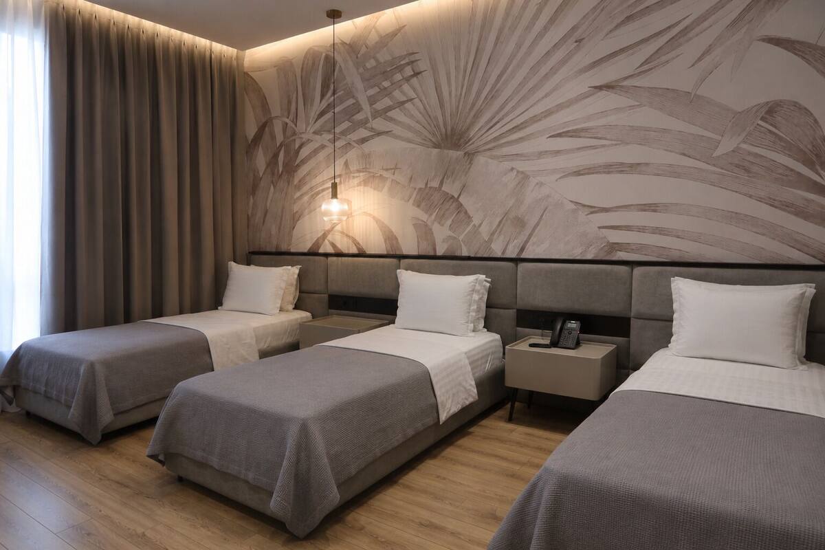 Deluxe Triple Room | Premium bedding, memory foam beds, in-room safe, desk