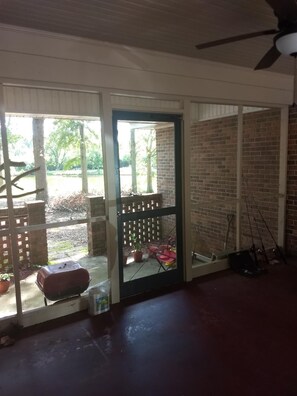 Enjoy al fresco dining and outdoor recreation in this patio area, complete with a barbecue grill and fishing gear.