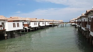A canal with waterway houses on stilts. - Wonderland Villa at Port Dickson (Port Dickson)