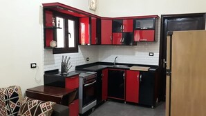 Apartment, 2 Bedrooms | Private kitchen | Full-size fridge, stovetop, electric kettle, cookware/dishes/utensils - Nile Panorama (Luxor)