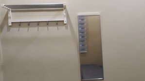 A bathroom with a towel rack and a mirror. - DeKota Homestay Jonker Melaka (Malacca City)