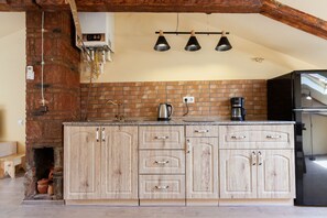 Fridge, microwave, stovetop, coffee/tea maker