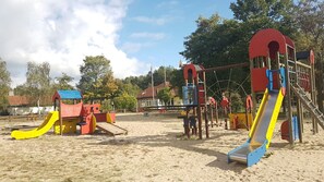 A playground with slides and climbing structures.