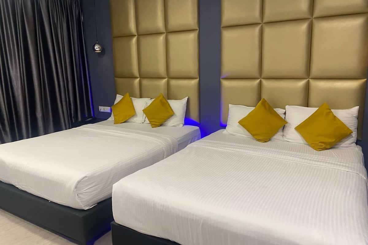 Habitación familiar (Suite) | Ropa de cama de alta calidad y artículos del minibar gratis