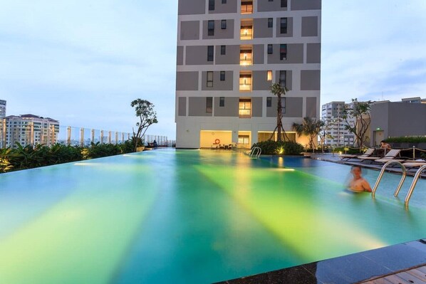 Enjoy breathtaking views from the rooftop infinity pool overlooking the city.