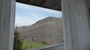 A view from a window overlooking a mountain landscape. - Studio with Jacuzzi "Balcony of the Len" (Soba)