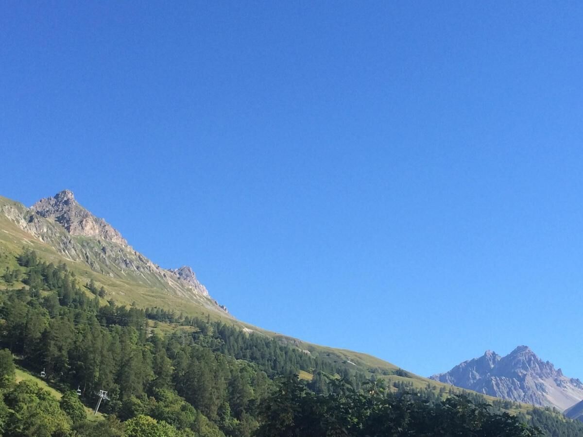 A mountainous landscape with a clear sky.