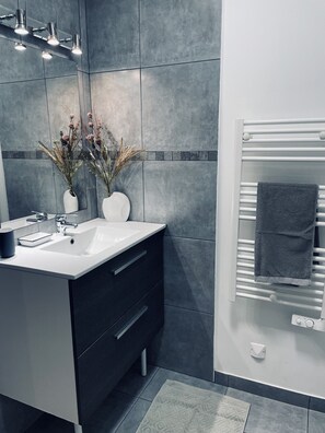 Shower, hair dryer, towels, toilet paper