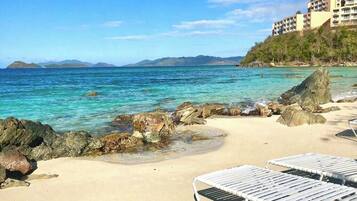On the beach, sun loungers, beach towels