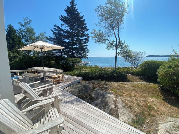 Outdoor dining - Luxurious Oceanfront Home, Private Island. Now booking for Fall and Winter 2025 (St George)