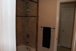 Combined shower/bathtub, hair dryer, towels, soap