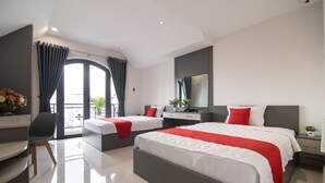 A modern hotel room with two beds, a desk, and a large window with curtains. - Bin Bin Hotel 7 - Near Ton Duc Thang University (Ho Chi Minh City)