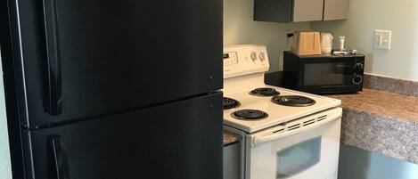 Standard Room, 2 Queen Beds, Smoking, Kitchenette | Living area | TV