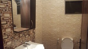 A bathroom with a sink, mirror, and toilet. - Private Family Apartment - Very Quiet Location (Amman)