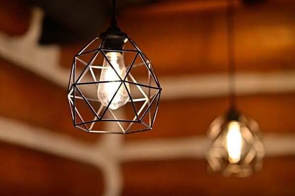 A hanging light fixture with a geometric design.