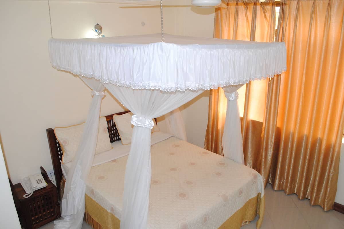 Premium bedding, desk, laptop workspace