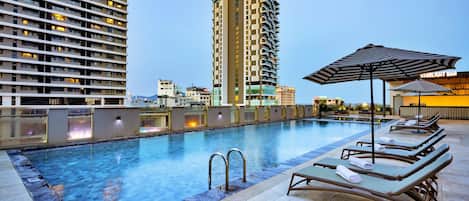 Outdoor pool, open 7:00 AM to 7:00 PM, pool loungers