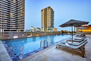 Outdoor pool, open 7:00 AM to 7:00 PM, sun loungers