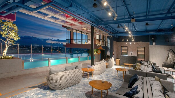 A rooftop lounge with a pool, seating areas, and a bar. - The Zuri Dumai (Dumai)