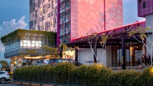 A modern hotel with a geometric facade, multiple floors, and a rooftop garden. - The Zuri Dumai (Dumai)