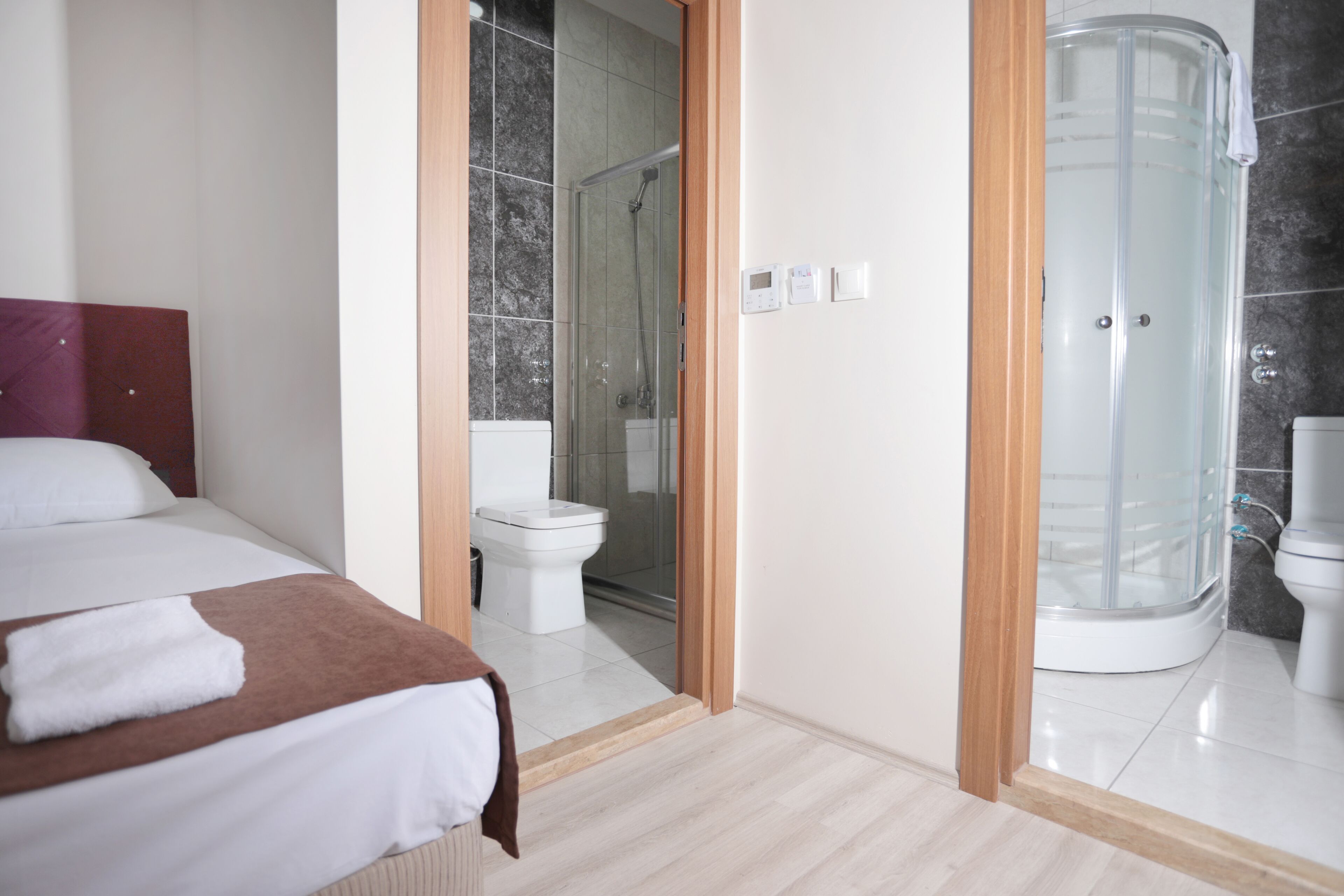 grand quadruple room | bathroom | shower, free toiletries, hair dryer, slippers