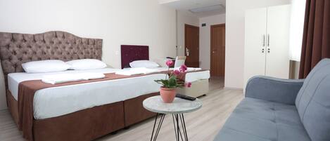 Family Triple Room | Minibar, desk, soundproofing, iron/ironing board