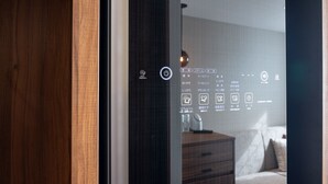 A hotel room with a bed, a dresser, and a wall-mounted control panel with various icons. - Hotel Forza Hakataeki Chikushi - Guchi II (Fukuoka)
