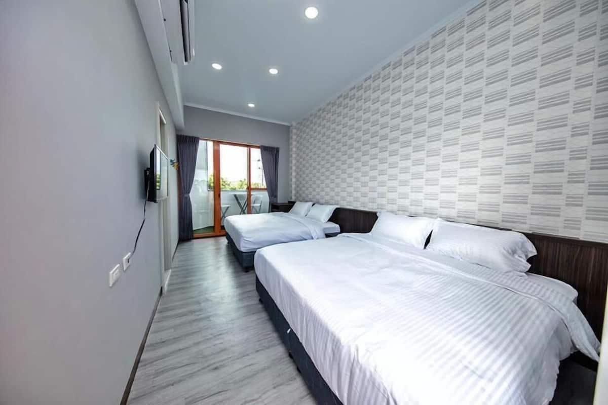 View Quadruple Room | Desk, blackout curtains, free WiFi, bed sheets