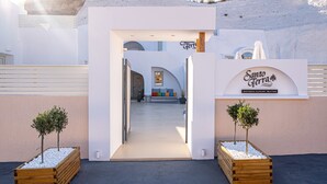 A hotel entrance with a sign reading "Santo Terra Antica Luxury Suites". - Santoterra Antigua Suites (Santorini)