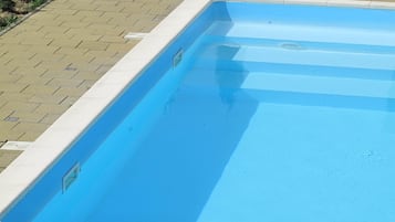 Seasonal outdoor pool, pool umbrellas, pool loungers